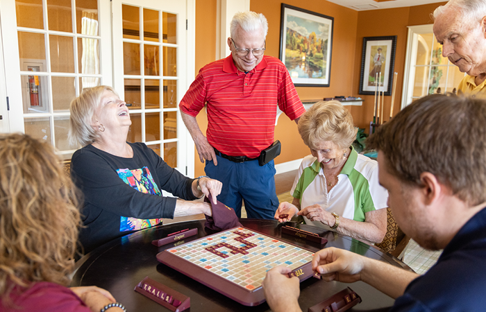 group of seniors playing games and laughing together
