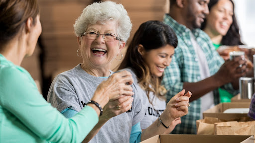 volunteer opportunities for seniors include working at a food bank like this older woman