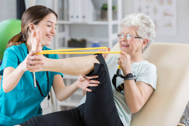 Senior woman stretching with bands