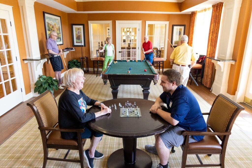 Seniors enjoying activities in the game room.