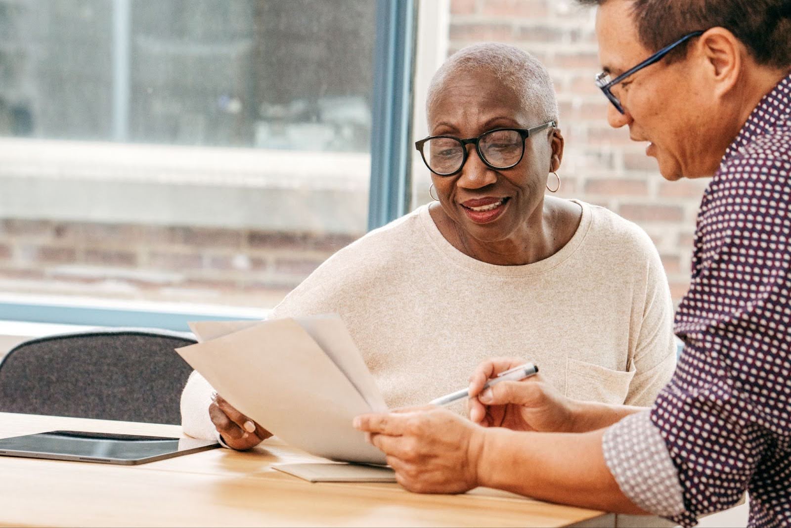 Senior woman getting information on CCRC Contract Types