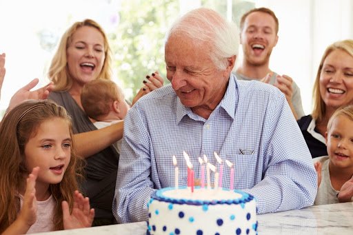 senior man at his 80th birthday party