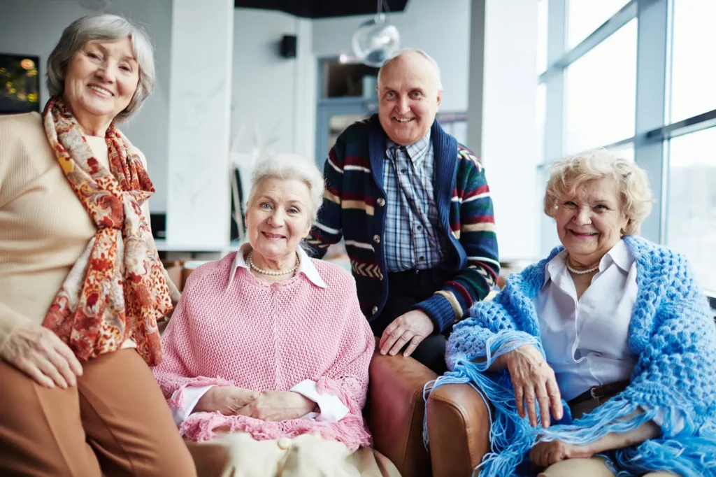 seniors sitting together and smiling in their home at WhiteStone, a retirement community in Greensboro, NC. 
